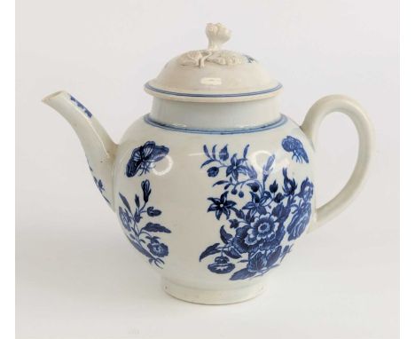 A Worcester blue and white porcelain teapot, circa 1770, of bullet form, decorated in the Three Flowers pattern, crescent mar