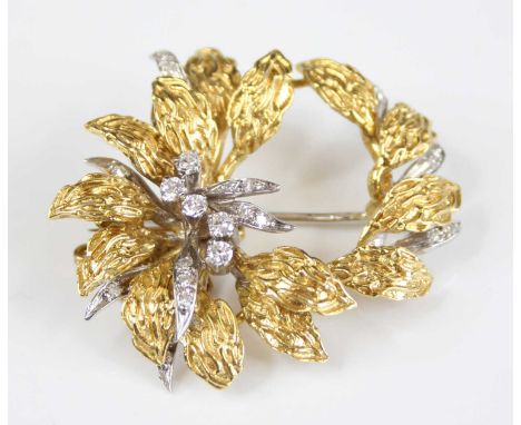 An 18ct yellow and white gold, diamond abstract floral brooch, having a moveable inner section set with twelve round brillian