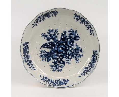 A Worcester blue and white porcelain cress drainer, circa 1775, transfer decorated in the 'Pinecone' pattern, crescent mark v