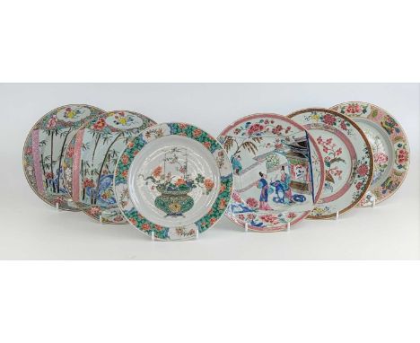 A Chinese famille verte porcelain plate, Kangxi period, enamel decorated with a vase of flowers, incense burner mark within d