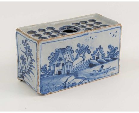 An English blue and white delftware flower brick, probably Liverpool, circa 1760, having nineteen ringed flower holes, decora