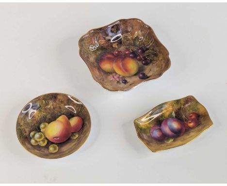 A Royal Worcester pin tray, circa 1936, hand painted with fruit, w.10.5cm, together with two similar Royal Worcester dishes (