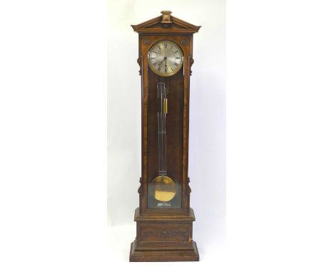 A late 19th century Vienna walnut longcase clock regulator, having a circular silvered Roman 10½" dial with engine turned cen
