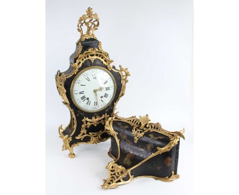 A French Louis XV style ebonised and gilt metal bracket clock, mid-19th century, having an unsigned white enamel convex dial,