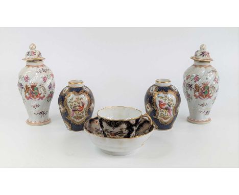 A Worcester porcelain tea cup and saucer, circa 1770, enamel decorated with cartouches of birds and flowers upon a scale blue