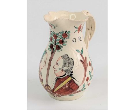 A Leeds creamware jug, circa 1770, of baluster form, having a crossover strapwork handle, enamel decorated with a couple besi