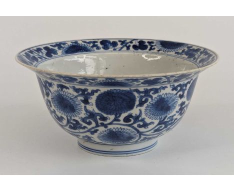 A Chinese blue and white porcelain bowl, Kangxi period, of klapmuts form, decorated with scrolling flowers, dia.15.5cmHairlin
