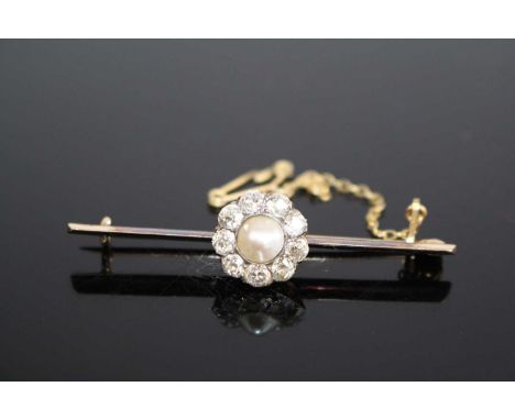 A yellow metal, pearl and diamond bar brooch, featuring a half pearl within a border of nine Old European cut diamonds, all i