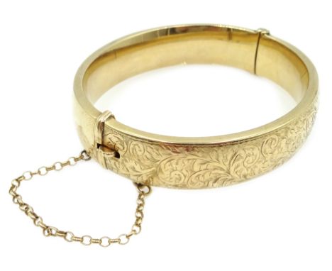 Gold hinged bangle with engraved decoration, hallmakred 9ct, approx 19.5gm Condition Report Click here for further images, co