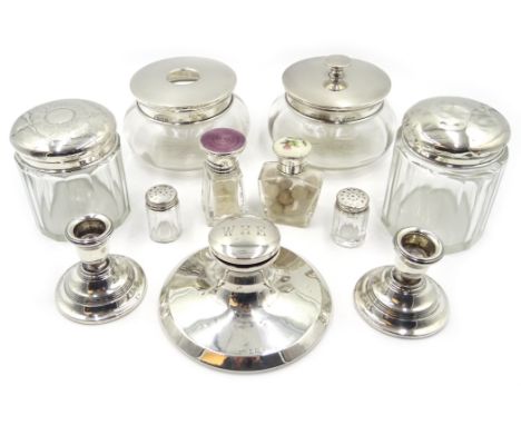 Two early 20th century glass scent bottles with silver and enamel stoppers, four dressing table jars with silver tops, pair o