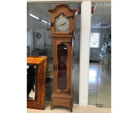 A light oak longcase clock