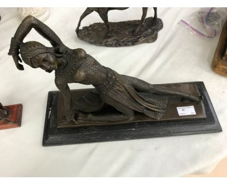 A bronze Art Deco-style reclining dancer after Chiparus