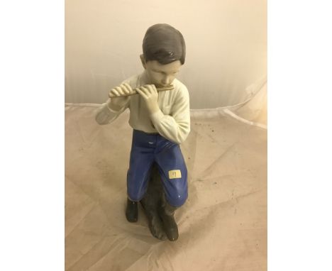 A B&G figure of a boy playing the flute