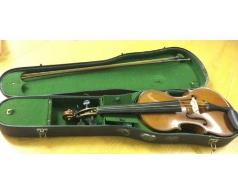 A cased violin and bow