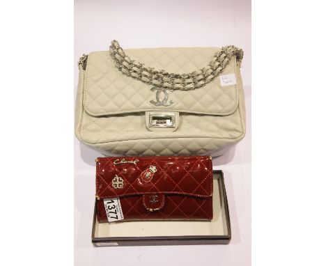 Two handbags marked Chanel, one boxed. Red bag has wear damage to corners. P&amp;P Group 2 (£18+VAT for the first lot and £2+