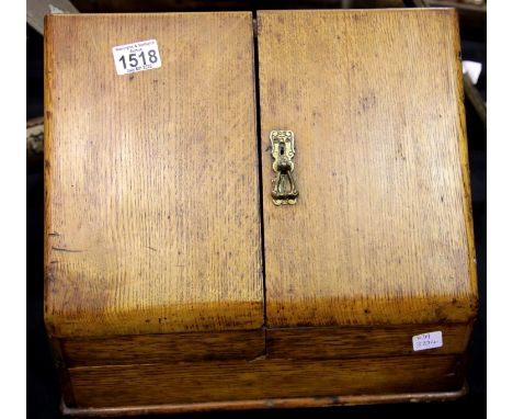 Oak stationery box with bifold doors and a lower drawer. P&amp;P Group 2 (£18+VAT for the first lot and £2+VAT for subsequent