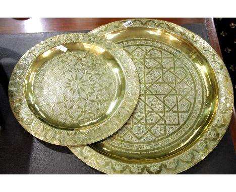 Two large brass patterned Eastern plates, largest D: 75 cm. P&amp;P Group 3 (£25+VAT for the first lot and £5+VAT for subsequ