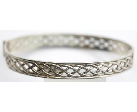 Sterling silver Celtic design hinged bangle, D: 10 mm, 13g. P&amp;P Group 1 (£14+VAT for the first lot and £1+VAT for subsequ
