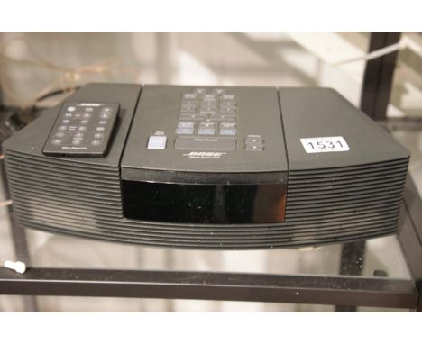 Bose Wave radio/CD player with remote. This lot is not available for in-house P&P.Condition Report: All electrical items in t