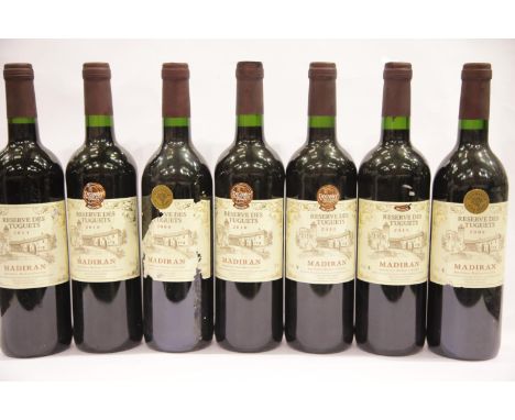 Seven bottles of Vintage Reserve des Tuguets Madiran 2x2008, 1x 2014, 4x 2010 75cl 13% vol. All foils and levels correct. P&a