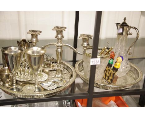 Two silver plated trays of mixed silver plated items, some drink related including silver napkin ring and spoon. P&amp;P Grou