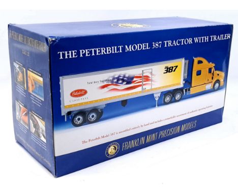 Franklin Mint, a boxed 1:32 Scale The Peterbilt Model 387 Tractor with Trailer. Although not checked for completness conditio