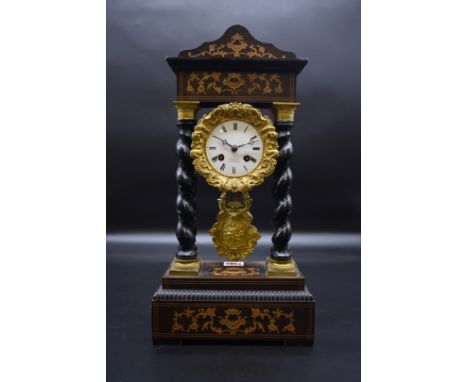 A 19th century French ebonized and inlaid portico clock,&nbsp;with gilt branch mounts, the dial and movement signed 'Blaquart