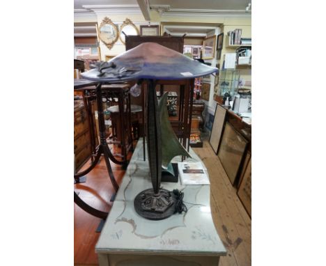 A large Art Deco wrought iron and coloured glass table lamp, by David Gueron, the shade etched 'Degue', 78cm high. 