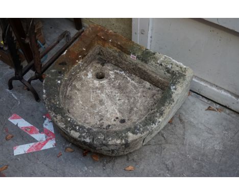 An old carved stone basin, 60.5cm wide x 58cm deep. 