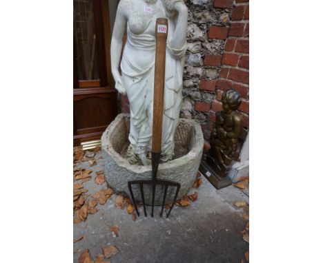 An old hay fork, with barbed prongs and truncated wood shaft; together with an early 20th century leather horseshoe. (2) 