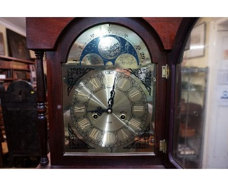 A reproduction beechwood longcase clock,&nbsp;the arched brass dial inscribed 'Lincoln, 31 day', 186.5cm high, with pendulum,