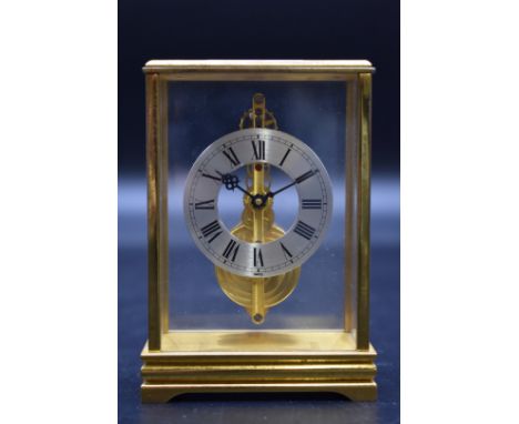 A small vintage Swiss brass timepiece, possibly Jaeger LeCoultre, 10.5cm high. 