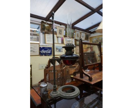 A Victorian adjustable oil lamp, with ruby glass reservoir. 