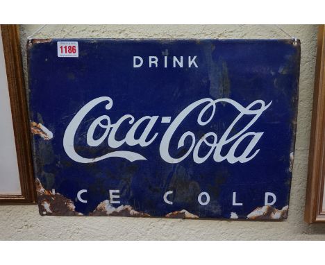 A vintage enamel 'Coca-Cola' sign, 27.5 x 40cm.&nbsp; 