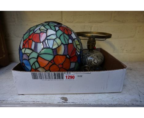 A serpentine table lamp, with stained and leaded glass shade,&nbsp;34cm high. 