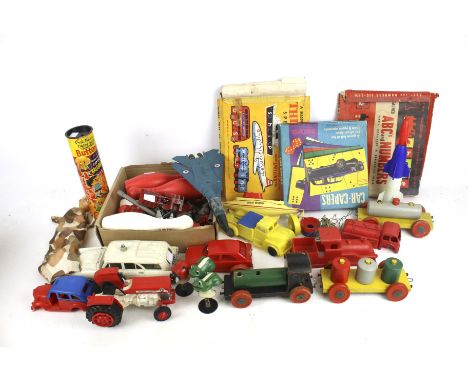 A quantity of toys and games including various playworn diecast and Corgi. A police car, tractor, jet aircraft, etc