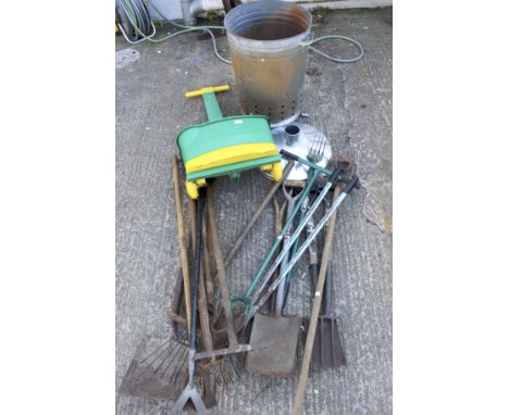 A job lot of assorted garden tools and an metal incinerator. Including shovels, racks, etc.