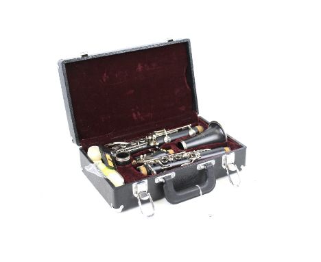 A cased clarinet by DY Musical Design USA. L33cm x D20cm x H10cm