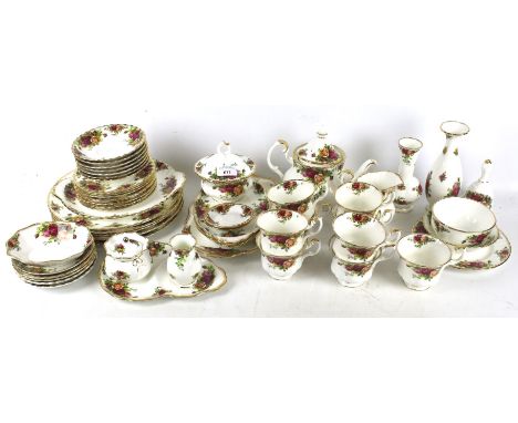 A Royal Albert Old Country Roses tea and dinner service. Including nine tea cups, a tea pot, sugar bowl, plates and vases, et