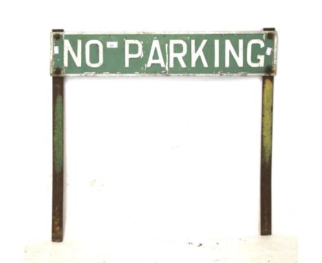 A vintage metal 'No Parking' sign. Mounted on a pair of stands, 82cm x 16cm 