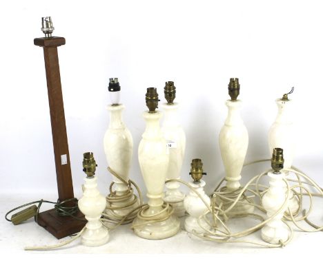 Eight 20th century alabaster lamp bases and a wooden example. The alabaster examples all with round bases, Max. H40cm, the wo