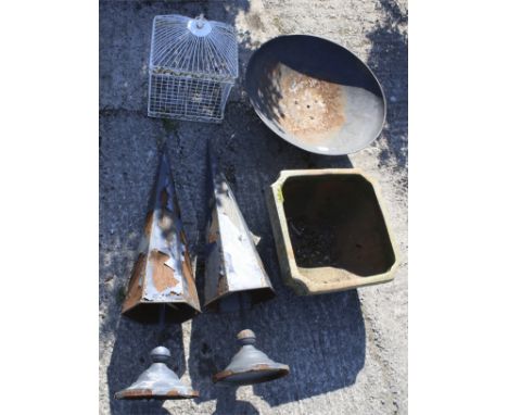 An assortment of garden items. Including two ornamental metal spikes, a wirework bird cage, a metal firepit, 58cm diameter, a