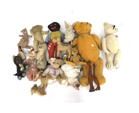 A collection of vintage teddy bears and soft toys. Of assorted sizes and designs, some bears with glass eyes and articulated 