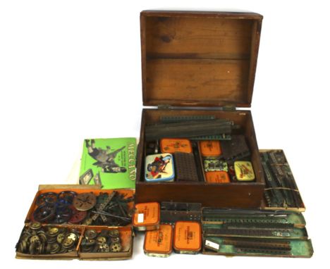 A large quantity of vintage playworn Meccano in a wooden box. Including parts, nuts and bolts, instruction booklets No. 0, No