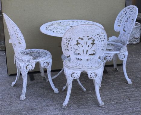 A circular white painted metal garden table and three chairs. The table on a tripod base, H65cm, the chairs H85cm