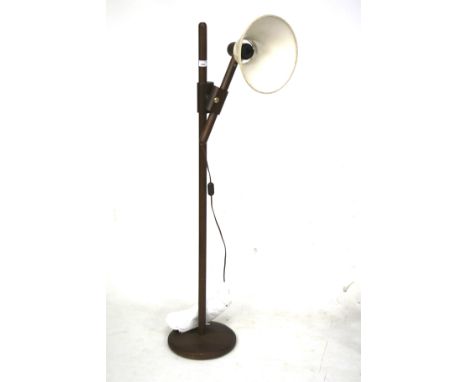 A 20th century stained wood standard lamp. With an adjustable fitting and brown shade, mounted on a circular support, H128cm 