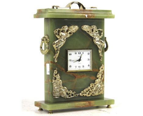 A mid-century onyx mantle clock. With a German Europa 2 jewel movement, white dial and Arabic numerals. Gilt metal features a