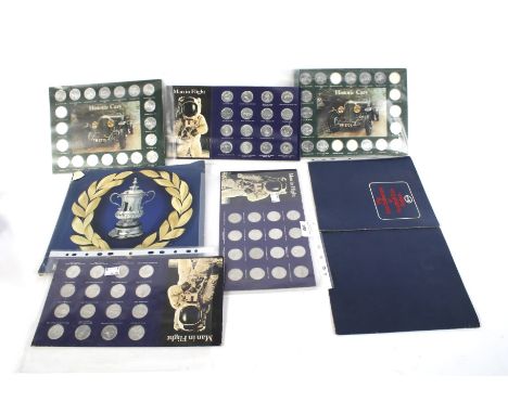 An assortment of collectors coins and memorabilia. Including an Esso collection of football badges, an 'F.A. Cup Centenary' 1