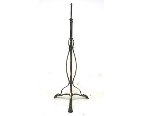A vintage cast metal lamp stand. With shaped details and mounted on a tripod stand, H131cm