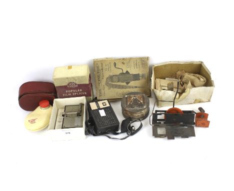An assortment of vintage camera related equipment and accessories. Including a role of film, a Ross Ensign 8mm Popular Splice